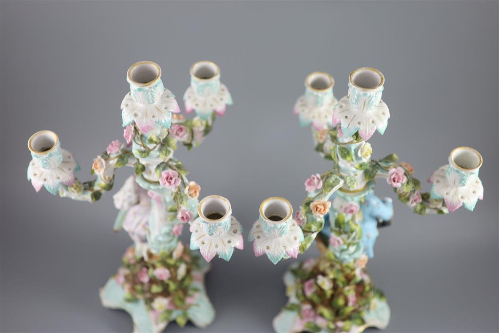 A pair of early 20th century Plaue porcelain figural candelabra, overall height 48cm